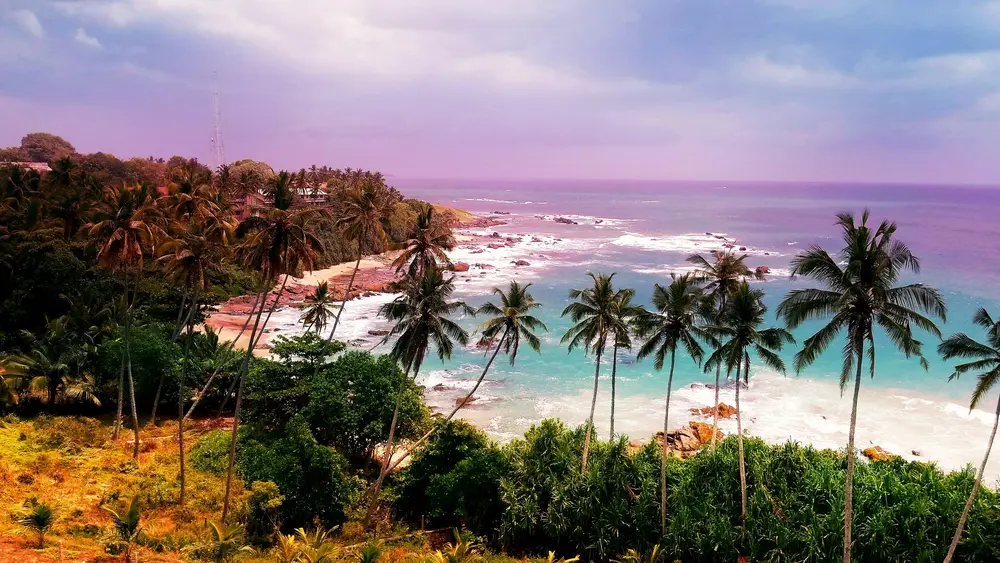 A picturesque view of Tangalle, a tranquil beach destination along Sri Lanka’s southern coast, known for its golden sandy beaches, crystal-clear waters, and serene atmosphere