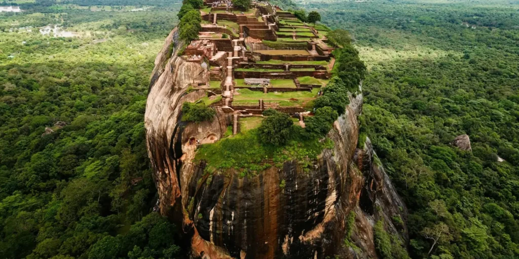 Aerial view of Sigiriya Lion Rock fortress rising above jungle in Sri Lanka
